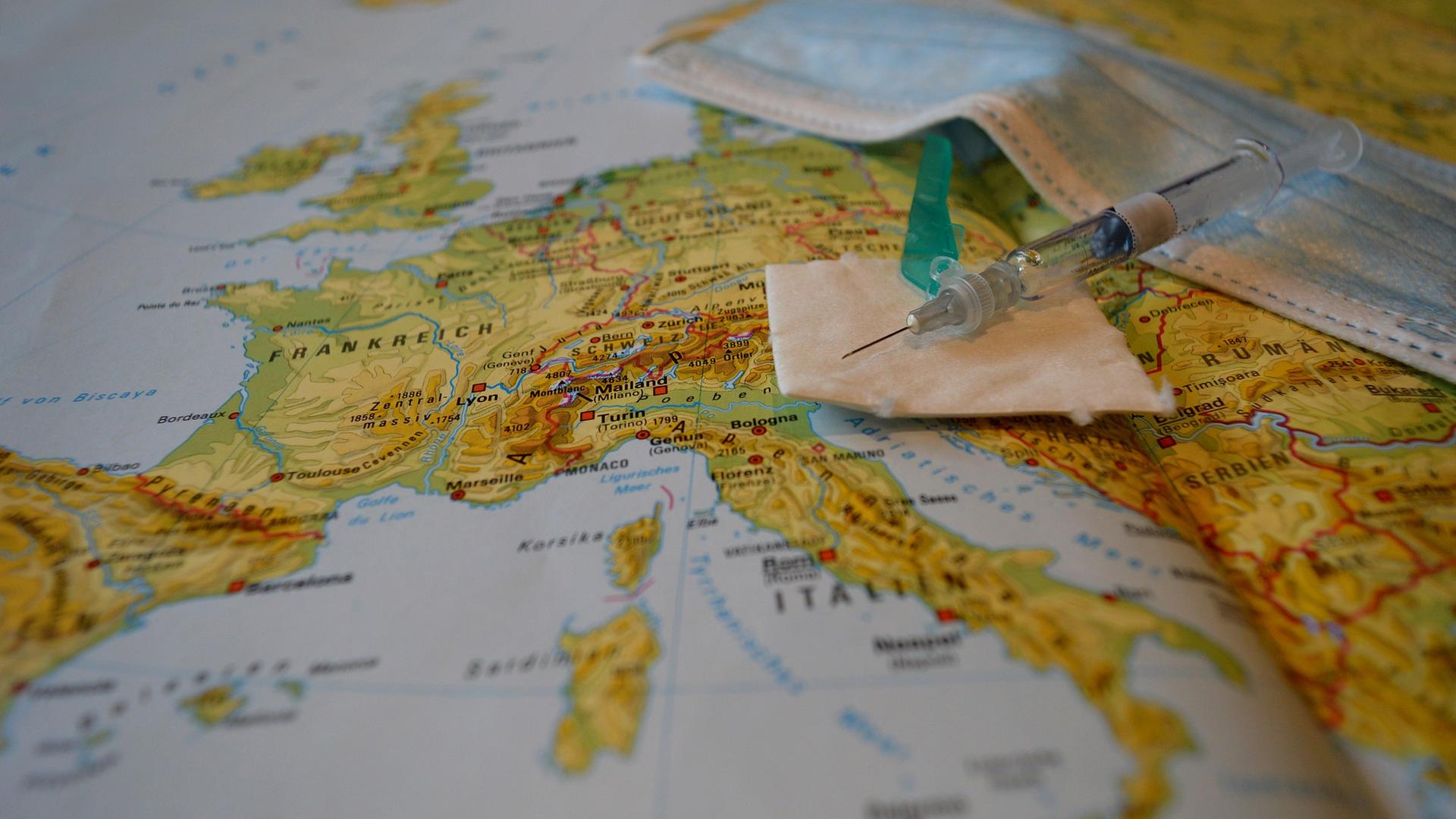 Spritze liegt auf Weltkarte