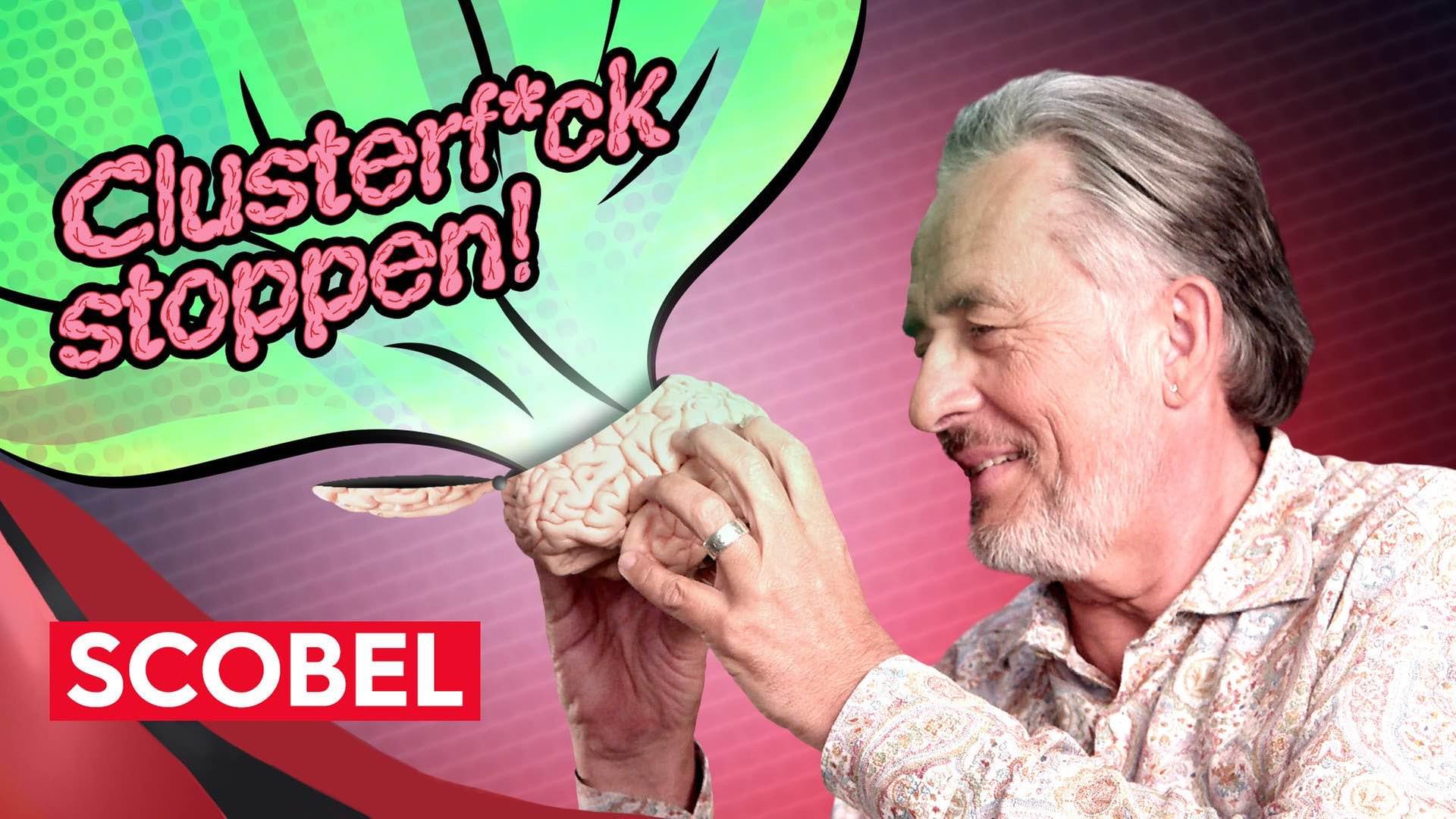 Gert Scobel hält ein Gehirn in den Händen. Aus dem Gehirn strömt eine Blase, in der "Clusterf*ck stoppen!" steht.