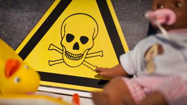 Symbol für Gift, davor Kinderspielzeug