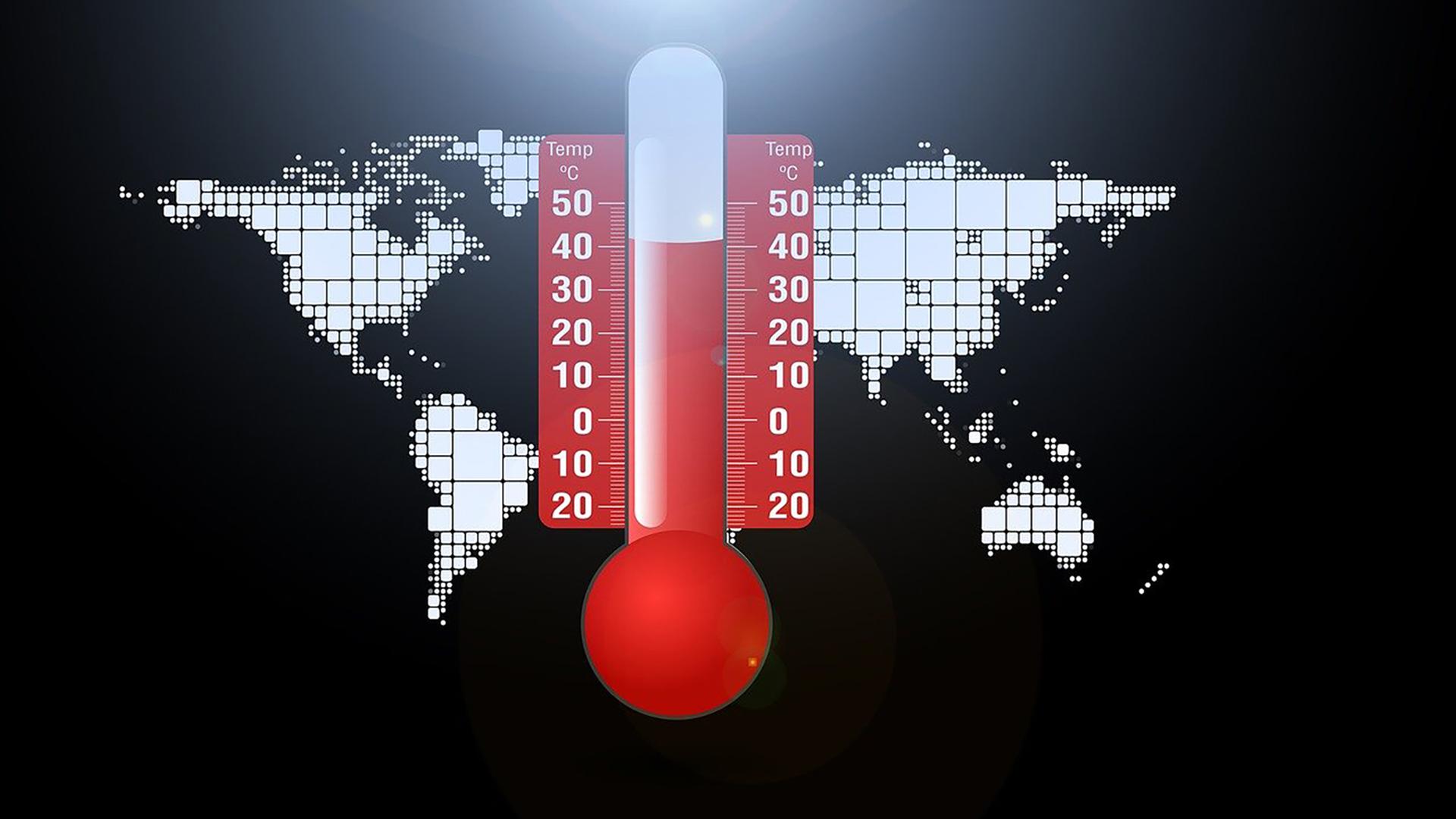 Thermometer über einer Weltkarte