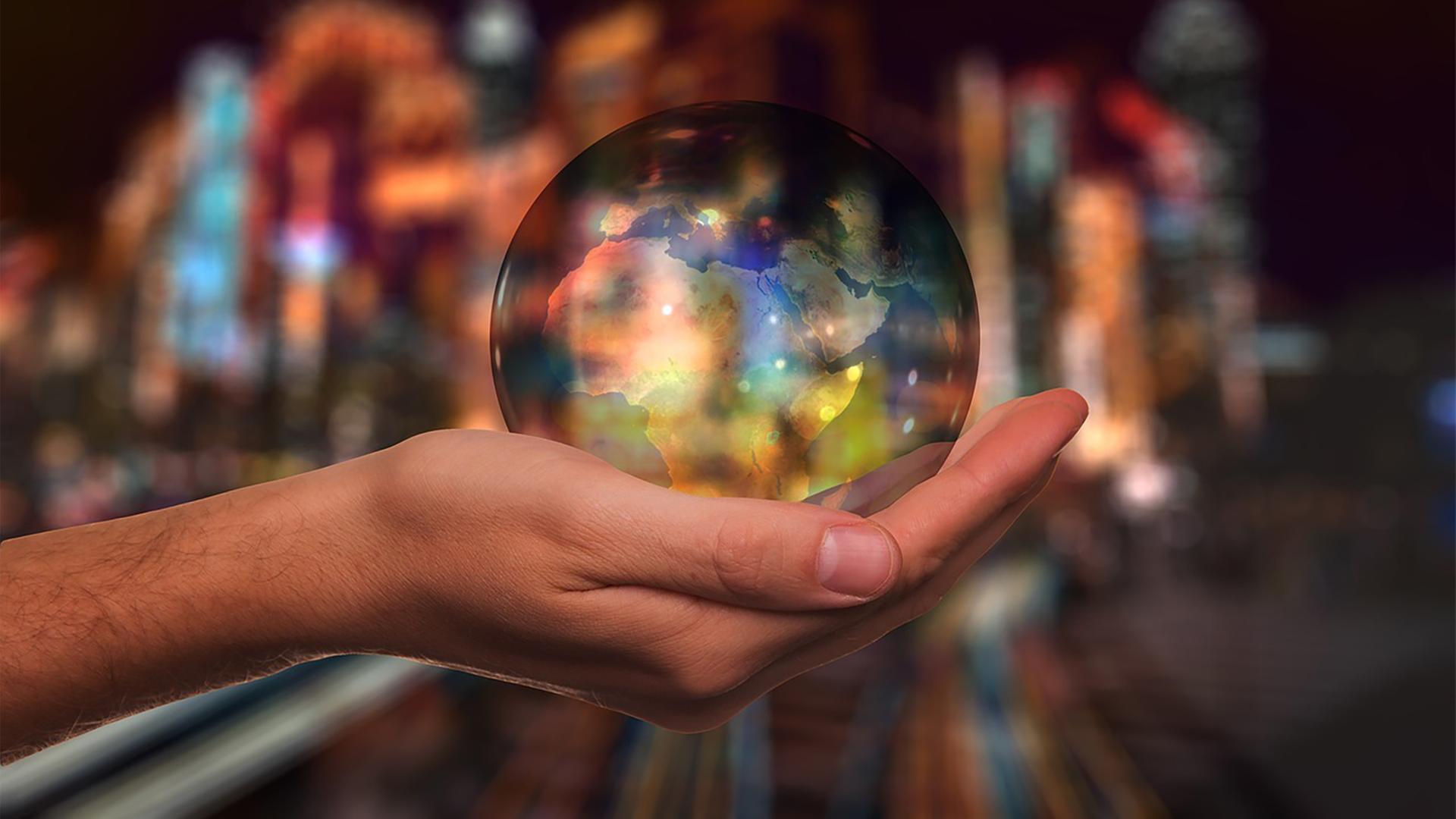 Globus in einer Hand