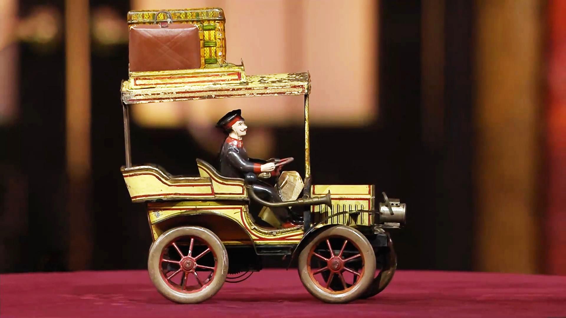 Ein Blechspielzeug-Auto.