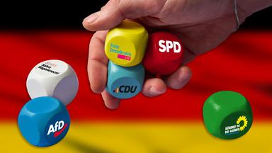 ChatGPT, Grok und DeepSeek häufiger im Sinne von SPD und Grünen. Manipulieren uns die Algorithmen? Wie neutral sind sie wirklich? (Im Bild zu sehen: Würfel mit Aufdruck verschiedener Parteien) 