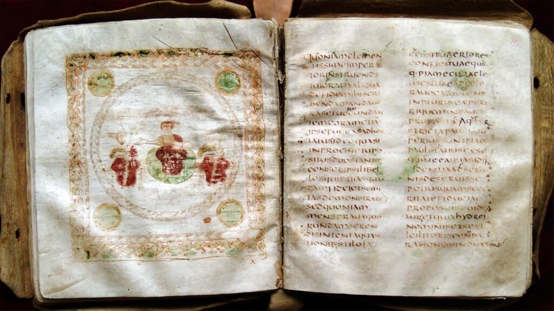 Ein mittelalterliches aufgeschlagenes Buch. Auf der linken Seite ist eine Zeichnung und rechts steht etwas geschrieben, das nicht lesbar ist.