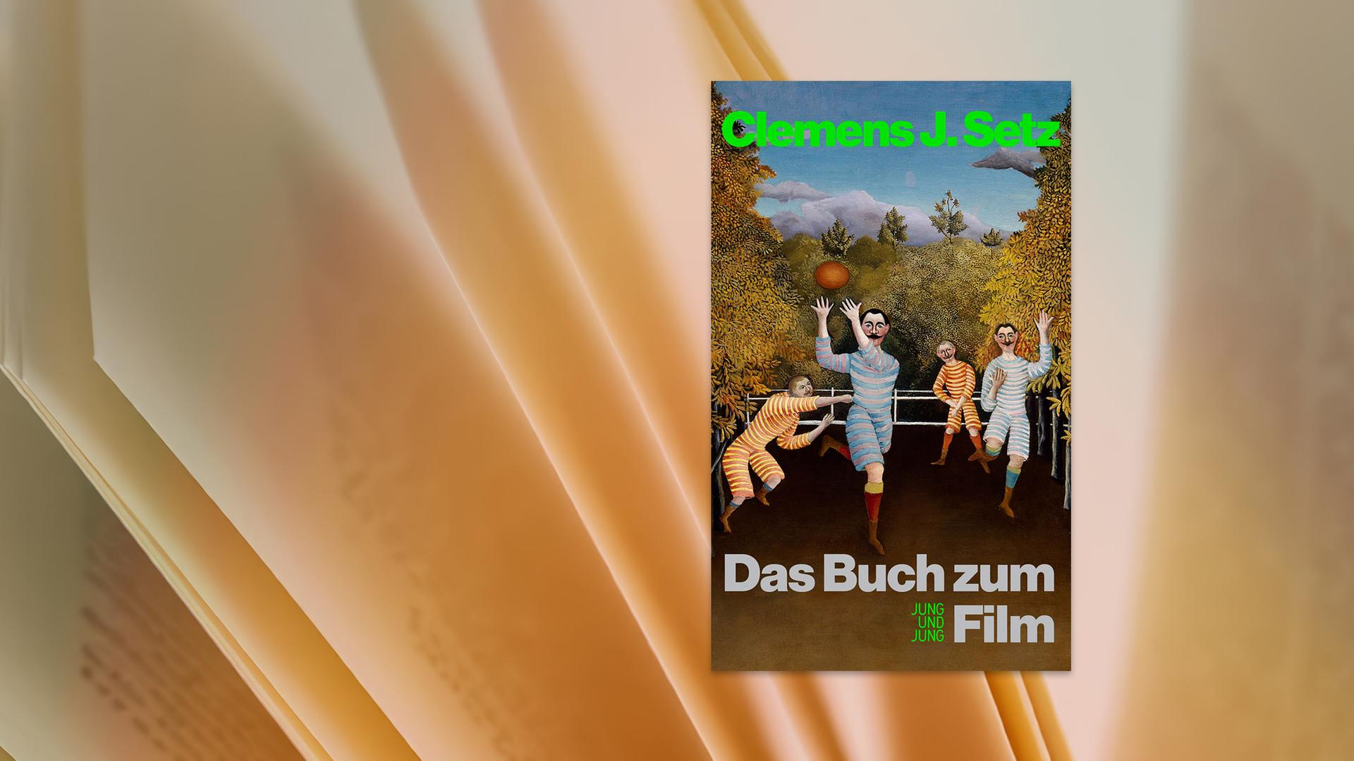 Auf einem Buchumschlang sind Männer in altmodischen geringelten Sportanzügen zu sehen, die mit einem Ball spielen.