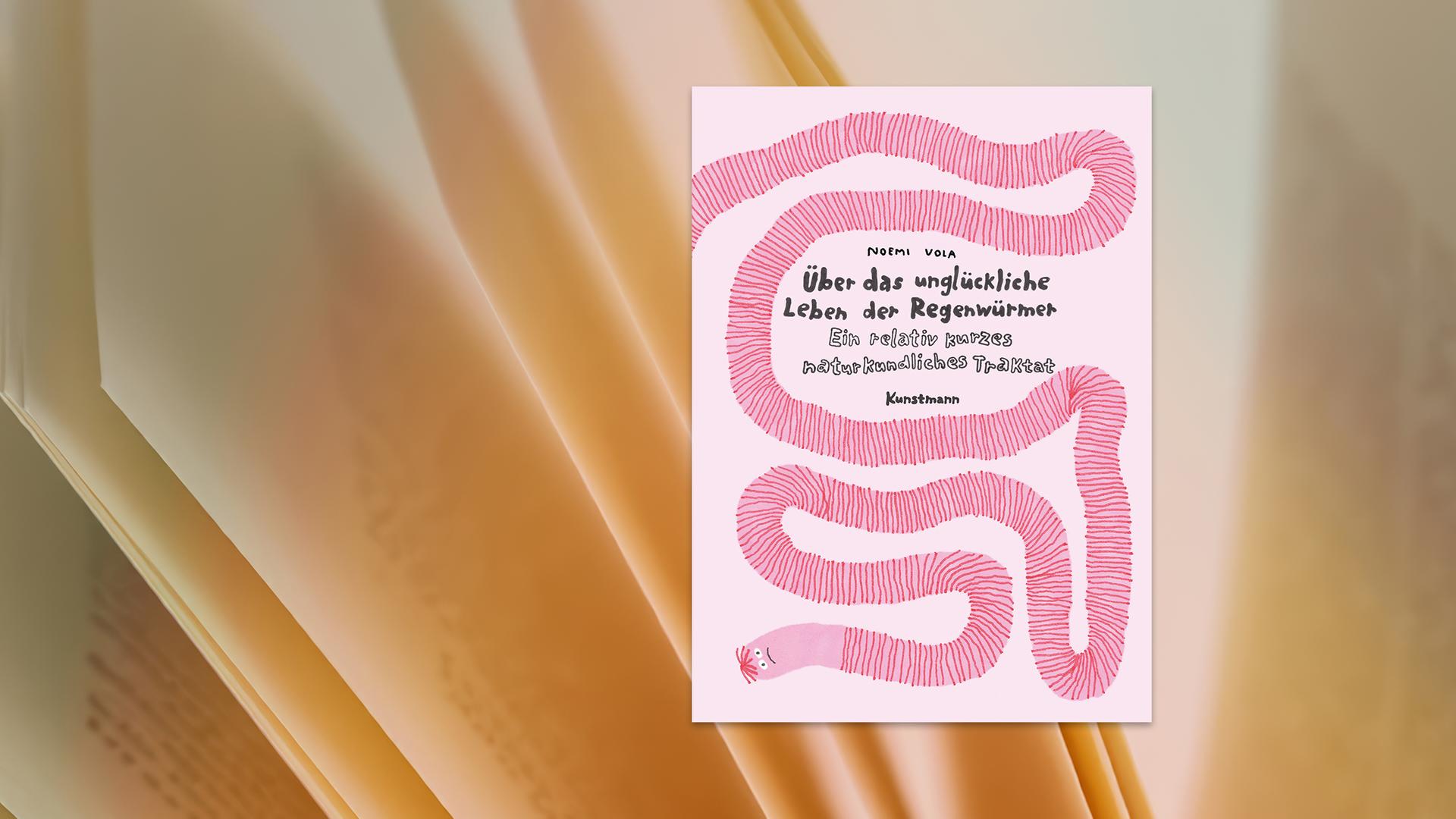 Ein Kinderbuch mit rosafarbenem Umschlag, auf dem sich ein langer gestrichelter Regenwurm windet.