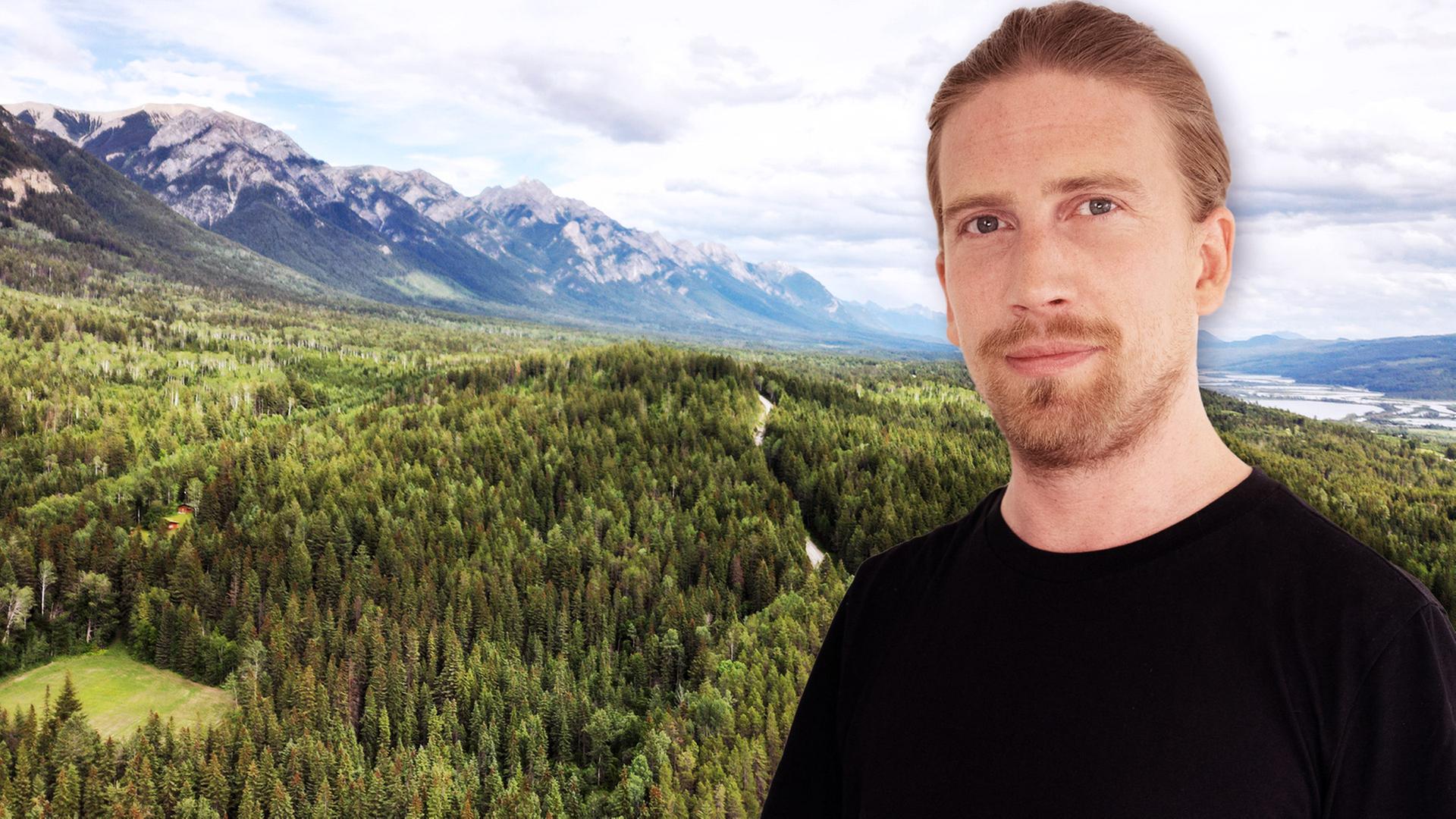 Das Bild zeigt Valentin Rahmel, auch bekannt als "Sarazar". Im Hintergrund sind die Wälder Kanadas zu sehen.