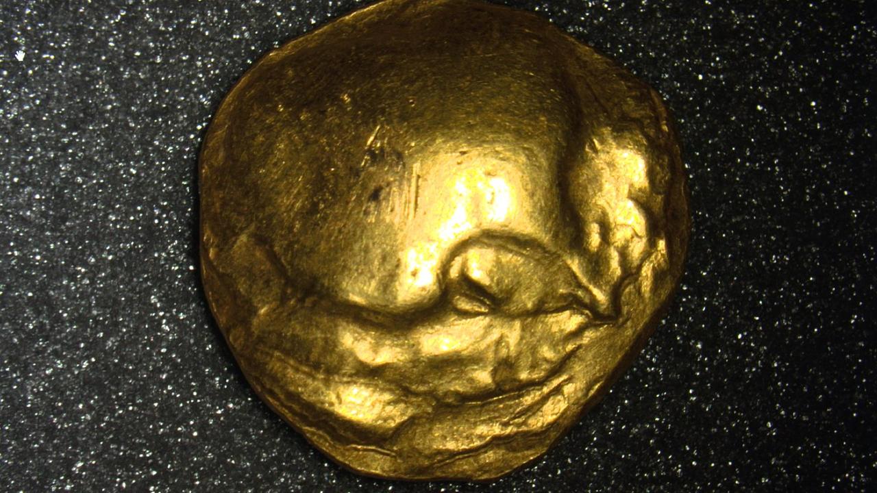 Eine einzelne goldene Münze