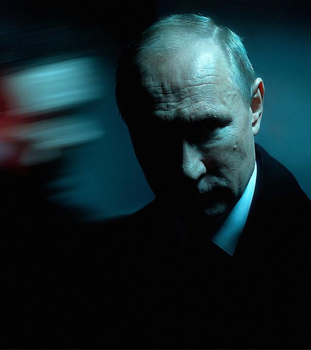 Putin mit einem Schatten im Hintergrund