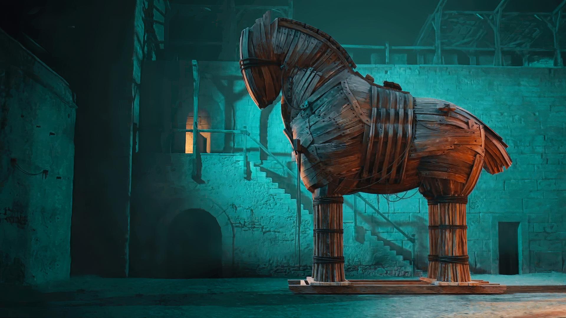 In der Bildmitte der Nachbau des Trojanischen Pferds, rechts im Bild Darsteller des Odysseus mit Bart. In der linken Bildhälfte ein CGI einer Stadtmauer und davor kämpfende Darsteller.