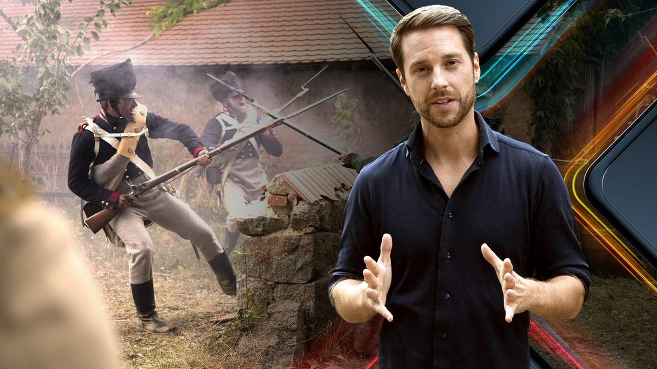 Spielszene. Darsteller kampieren unter freiem Himmel.